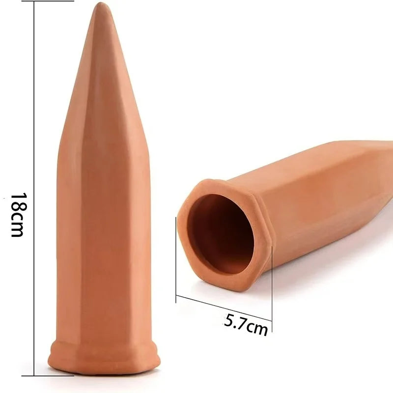 Terracotta self-watering plant stakes in potted plants