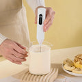 Handheld electric milk frother product photo
