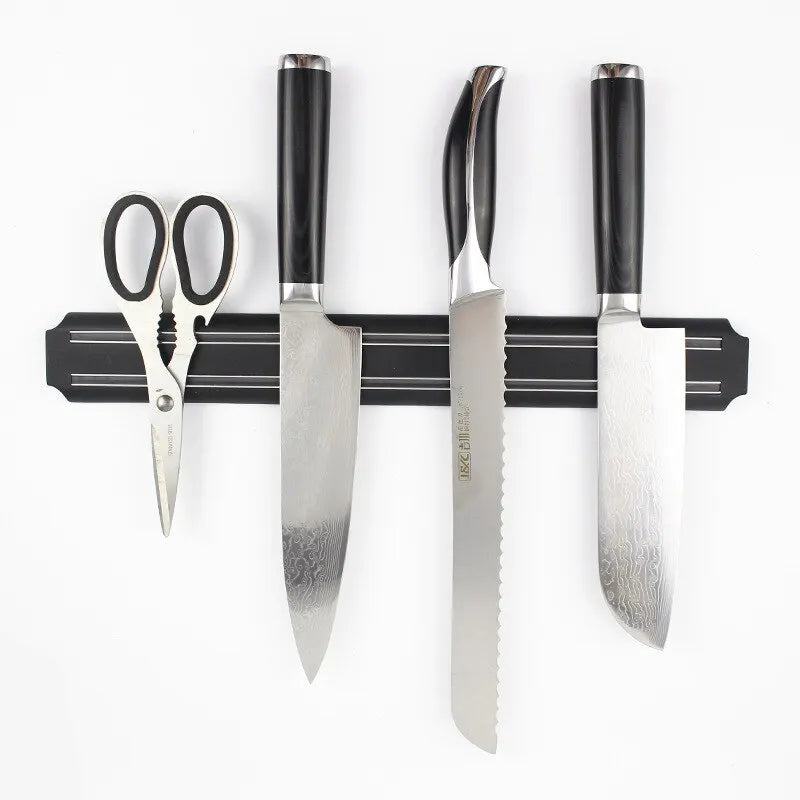Magnetic knife bar holding kitchen knives