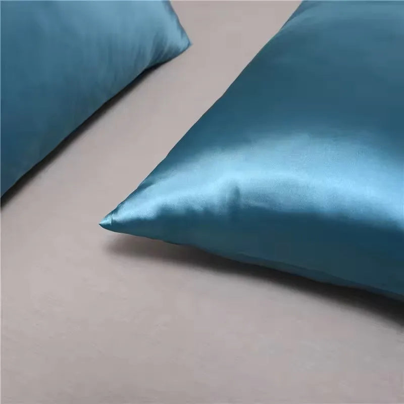 Cooling satin pillow cover on bed