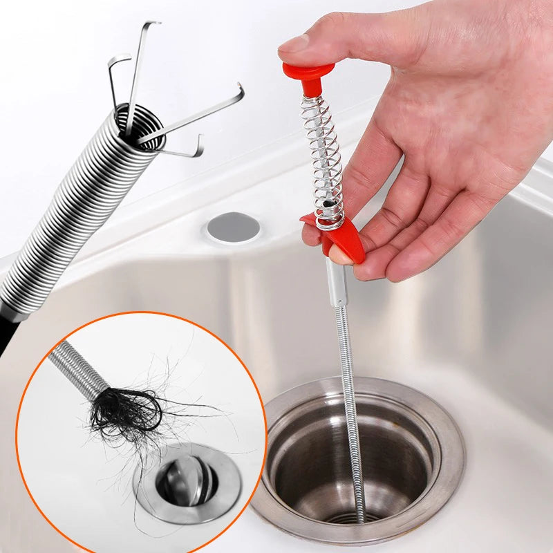 Drain snake pulling hair clog from sink drain