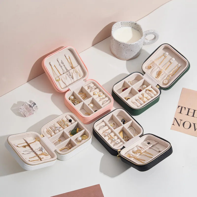 Portable jewelry case open showing compartments