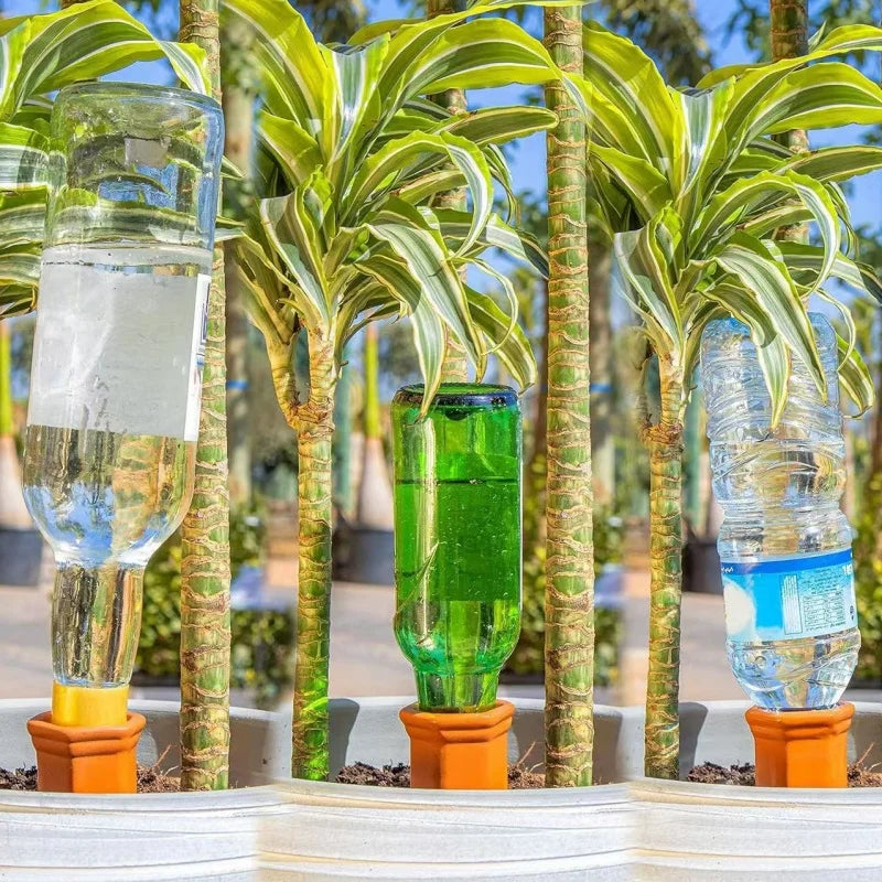 Set of four self-watering plant stakes