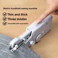Mini handheld sewing machine stitching fabric